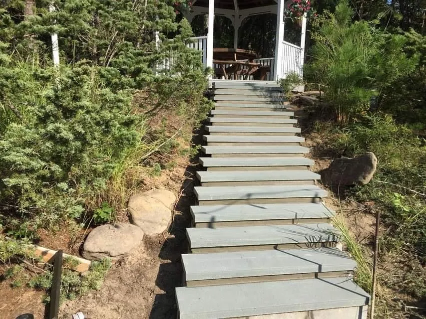 Natural stone garden staircase and walkway built into a landscaped Long Island hillside